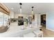 Modern kitchen with stainless steel appliances, counter seating, and herringbone floors at 12204 45Th Avenue W Dr, Cortez, FL 34215