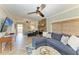 Cozy living room featuring a stone fireplace, comfortable seating, and stylish decor at 12204 45Th Avenue W Dr, Cortez, FL 34215