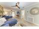 Open-concept living room featuring herringbone floors, comfortable seating, and access to other areas at 12204 45Th Avenue W Dr, Cortez, FL 34215