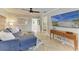 Bright living room featuring a comfortable sofa, stylish decor, and open access to other rooms at 12204 45Th Avenue W Dr, Cortez, FL 34215