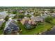 Aerial view of homes, featuring lake views and well-maintained lawns and pools at 12211 Aster Ave, Bradenton, FL 34212