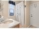 Bright bathroom with a shower/tub combo, a wooden vanity, and natural light at 12211 Aster Ave, Bradenton, FL 34212