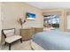Bright bedroom with a view to the pool, offering a serene and relaxing atmosphere at 12211 Aster Ave, Bradenton, FL 34212