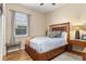 Cozy bedroom with hardwood floors, neutral walls, with a window view at 12211 Aster Ave, Bradenton, FL 34212