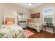 Charming bedroom with twin beds, hardwood floors, a neutral color scheme and lots of natural light at 12211 Aster Ave, Bradenton, FL 34212