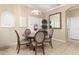 Cozy dining area featuring a round table, four chairs, and a decorative chandelier at 12211 Aster Ave, Bradenton, FL 34212