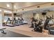 Spacious gym with treadmills, stationary bikes, weight machines, and large windows for ample natural light at 12211 Aster Ave, Bradenton, FL 34212