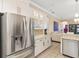 Spacious kitchen featuring stainless steel appliances, granite countertops and glass-front cabinets at 12211 Aster Ave, Bradenton, FL 34212