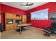 Spacious office featuring built-in shelves, ample natural light, and comfortable seating at 12211 Aster Ave, Bradenton, FL 34212