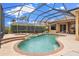 Relaxing screened-in pool and spa, complete with lush landscaping for ultimate privacy at 12211 Aster Ave, Bradenton, FL 34212