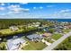 Breathtaking aerial view of waterfront homes along canals, providing beautiful water access at 12396 Bacchus Rd, Port Charlotte, FL 33981