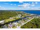 Stunning aerial view of a waterfront community with canal access leading to open water at 12396 Bacchus Rd, Port Charlotte, FL 33981