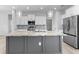 Bright kitchen featuring a large island with granite countertop, stainless appliances, and white cabinets at 12396 Bacchus Rd, Port Charlotte, FL 33981