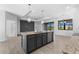 Stylish kitchen island with modern pendant lighting, and contemporary finishes at 12396 Bacchus Rd, Port Charlotte, FL 33981