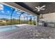Screened lanai with built-in grill, outdoor kitchen, and a beautiful view of the canal at 12396 Bacchus Rd, Port Charlotte, FL 33981