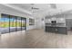 Spacious living room featuring an open layout with hardwood floors, perfect for entertaining guests at 12396 Bacchus Rd, Port Charlotte, FL 33981