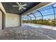 Screened-in outdoor living space boasting a refreshing pool, gray pavers, and waterfront views perfect for entertaining at 12396 Bacchus Rd, Port Charlotte, FL 33981
