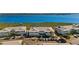 An aerial view showcasing the stunning property, parking, and access to the water at 1323 Perico Point Cir # 107, Bradenton, FL 34209