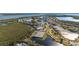 Aerial view of the waterways, community tennis courts, pool, and residential housing at 1323 Perico Point Cir # 107, Bradenton, FL 34209