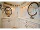 Elegant bathroom with dual vanities, granite countertop, and cabinet storage at 1323 Perico Point Cir # 107, Bradenton, FL 34209