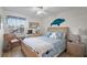 Bright bedroom featuring a ceiling fan, and coastal decor at 1323 Perico Point Cir # 107, Bradenton, FL 34209