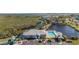 Aerial view of the community pool and clubhouse near the waterway at 1323 Perico Point Cir # 107, Bradenton, FL 34209