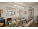 The dining room has a decorative chandelier and a pass-through view into the kitchen area at 1323 Perico Point Cir # 107, Bradenton, FL 34209