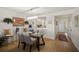 Dining room with modern chandelier, neutral paint, modern flooring and view to the entrance at 1323 Perico Point Cir # 107, Bradenton, FL 34209