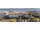 Well-maintained condo building with gray siding, tile roof, nicely manicured landscaping and plenty of parking at 1323 Perico Point Cir # 107, Bradenton, FL 34209
