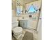 Bathroom featuring a stylish vanity with a white sink, a modern toilet, and a neutral color scheme at 1633 Leisure Dr # M-37, Bradenton, FL 34207