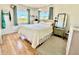 Bright bedroom with gleaming hardwood floors, and natural light at 1633 Leisure Dr # M-37, Bradenton, FL 34207