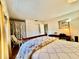 This bedroom features a closet, hardwood floors and natural light at 1633 Leisure Dr # M-37, Bradenton, FL 34207