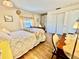 This bedroom features a closet, hardwood floors and neutral decor at 1633 Leisure Dr # M-37, Bradenton, FL 34207
