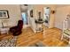 Hallway leading to a light-filled living area, showcasing the home's open and airy layout at 1633 Leisure Dr # M-37, Bradenton, FL 34207