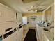 Efficient laundry room equipped with multiple washers and dryers for resident convenience at 1633 Leisure Dr # M-37, Bradenton, FL 34207