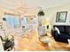 Bright living area with an open floor plan, dining space, and comfortable seating at 1633 Leisure Dr # M-37, Bradenton, FL 34207