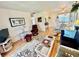 Comfortable living room with hardwood floors, open layout, and dining area at 1633 Leisure Dr # M-37, Bradenton, FL 34207