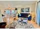 Cozy living room featuring wood floors, neutral walls, and an open dining area at 1633 Leisure Dr # M-37, Bradenton, FL 34207