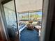 Enclosed porch features comfortable seating and an open view of the community at 1633 Leisure Dr # M-37, Bradenton, FL 34207