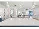 Bright and airy kitchen with an open layout and a large island with bar seating at 1647 Siesta Dr, Sarasota, FL 34239