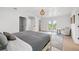 Airy main bedroom offering access to a private balcony, a seating area, and an ensuite bathroom at 1647 Siesta Dr, Sarasota, FL 34239