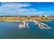 Aerial photo highlights boat docks on the water in a community with access to waterfront living at 1709 6Th E St, Palmetto, FL 34221