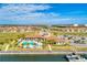 A serene aerial view of a community clubhouse by the water, complete with a pool and ample parking at 1709 6Th E St, Palmetto, FL 34221