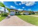 Beautiful single-Gathering home with lush landscaping, waterfront views and a two-car garage at 1709 6Th E St, Palmetto, FL 34221