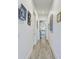 Hallway featuring wood-look flooring and neutral paint at 1709 6Th E St, Palmetto, FL 34221