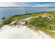 Community kayak storage area with three kayaks next to a fenced area with a lake view at 1709 6Th E St, Palmetto, FL 34221