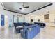Inviting living room area with a large sofa, tile floors, and views of the kitchen at 1709 6Th E St, Palmetto, FL 34221
