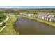 A stunning aerial view of condos with a lake and the golf course at 17626 Gawthrop Dr # 305, Bradenton, FL 34211
