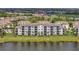 Aerial view of waterfront condominium buildings, showcasing lush surroundings and scenic views at 17626 Gawthrop Dr # 305, Bradenton, FL 34211