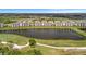 A beautiful aerial view of the condos, with a lake and the adjacent golf course at 17626 Gawthrop Dr # 305, Bradenton, FL 34211